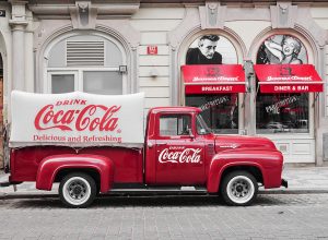 A picture of a truck bearing the logo of coca cola-Crazy Facts about Coca Cola