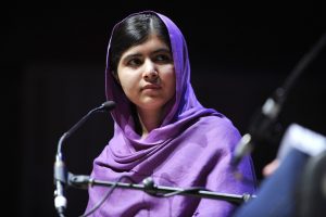 A picture of Women's rights activist Malala Yousafzai -quotes by women's rights activists.  Youngest recipient of the Nobel Peace Prize-quotes by women's rights activists.