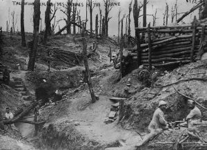 A picture depicting soldiers sitting in the trenches of the wood called Des Fermes in the Somme.