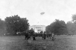 A picture of an airship flying above the White House