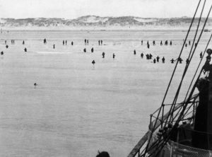 A picture depicting the Allied troops wading toward rescue ships off Dunkirk beach.