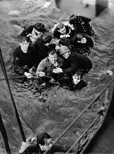 A picture of troops climbing aboard a vessel