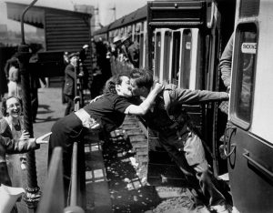 A picture of a troop greeted by his girlfriend