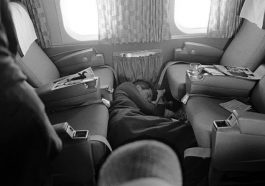 An image of Kennedy sleeping on the floor of a plane