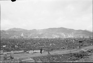 A picture of soldiers along through the devastation caused by the atomic bombing of Hiroshima.Â