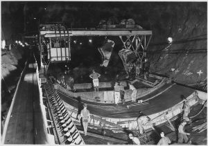 A picture of the workers are pouring the arch formwork in place-construction of the Hoover Dam