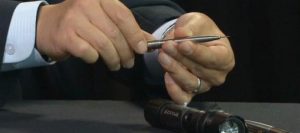 A picture of the poison pen and the flashlight gun