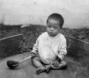 A picture of a child displayed at a human zoo