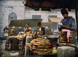 A picture of Bakers and cooks selling their wares on the Rue de Stamboul