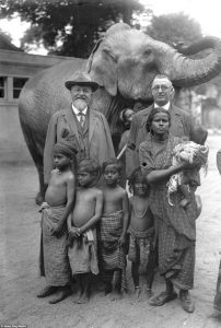 A picture of a German zoologist and an African family